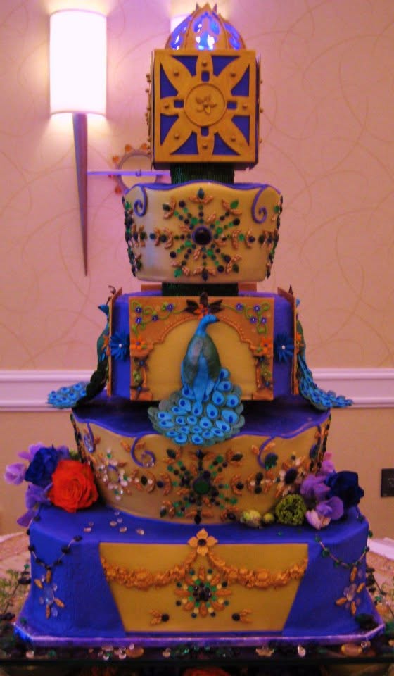 Opulent peacock jeweled tiered cake