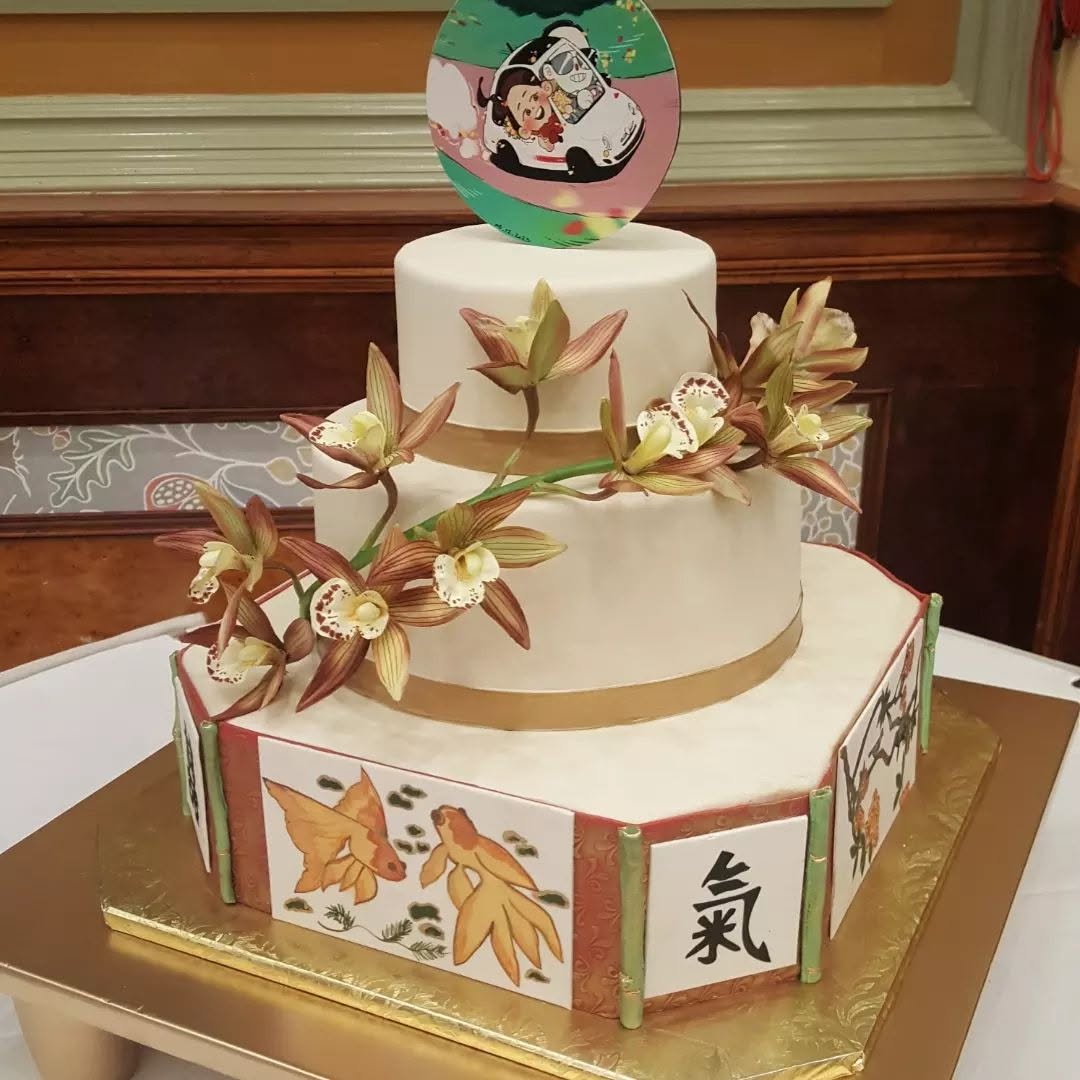 Japanese-themed tiered cake with orchids