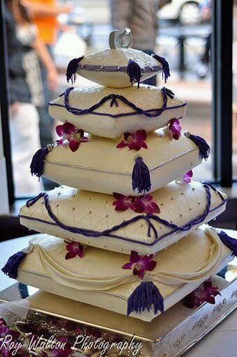 Pillow-shaped tiered cake with tassels